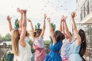 a group of women celebrate as they learn how to party sober