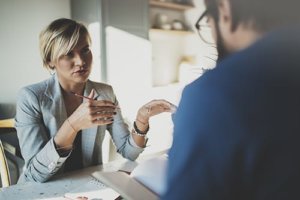 A counselor explains some facts to a client