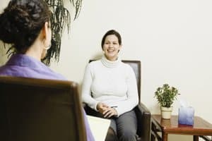 a woman takes advantage of addiction therapy services Portland Maine trusts
