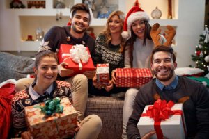a family with presents showing how to stay sober for christmas