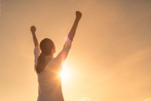 woman celebrating because she learned relapse prevention skills